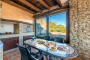 Outdoors dining area with wood oven